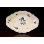 An 18th Century Worcester Dish painted in underglaze blue with a sprays of flowers to the centre