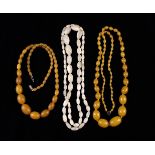 Three Vintage Bead Necklaces: A String of graduated oval mother of pearl beads 39¼" (100 cm) in