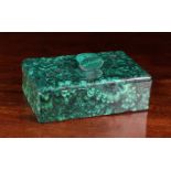 A Zambian Malachite Effect Box of rectangular form; the flat lid centred by an oval handle,