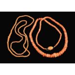 Two Strings of Coral Beads.