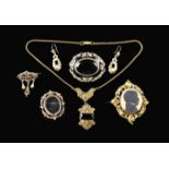 A Group of Victorian Jewellery: A portrait brooch set with a painted silhouette profile of a