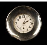 A Small Swiss Made Clock in a silver clad surround hallmarked Birmingham 1915.