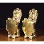 A Pair of Early 19th Century Cast Brass Lions Sejant.