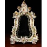 A Highly Decorative 19th Century Porcelain-framed Strut Mirror.