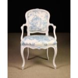 A Louis XV Style Cream Painted Fauteuil.