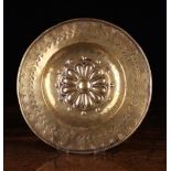 An Early 18th Century Brass Repoussé Plate.