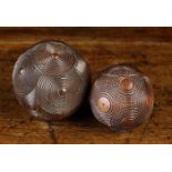 Two 19th Century Puzzle Balls intricately turned with concentrically ringed roundels,
