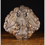 A 17th Century Flemish Oak Wall Appliqué intricately carved with a dove symbolising The Holy Spirit,
