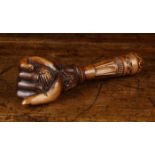 A 19th Century Treen Nut Cracker carved in the form of a hand clenching a nut with screw thread