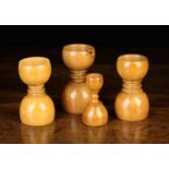 Four 19th Century Turned Boxwood Double Ended Measures of turned cups form with reel turned waist