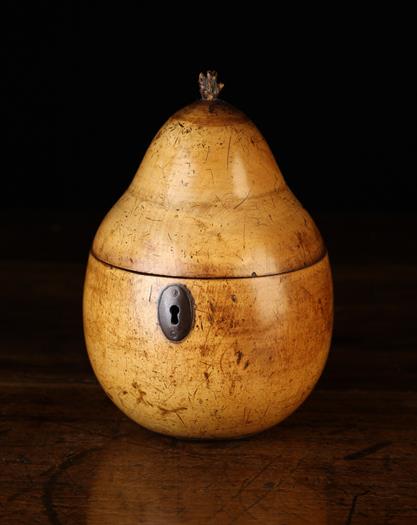 A Fine 19th Century Turned Fruitwood Tea Caddy in the form of a pear, 5¾" (14.5 cm) in height.