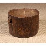 An Early 19th Century Rustic Dug-out Irish Bog Butter Tub with integrated pierced lug handles,