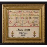 A Victorian Sampler worked in coloured wools with the alphabet above 'Annie Scott Birstall 1882'