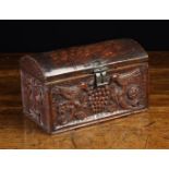 A Pretty Dome-topped Wooden Casket enriched with decorative carving depicting two birds perched on