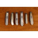 Six Pretty Silver Folding Fruit Knives with decorative mother-of-pearl clad handles.