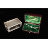 A Silver Match Box Cover hallmarked Birmingham 1937 with machine engraved sides in cast foliate