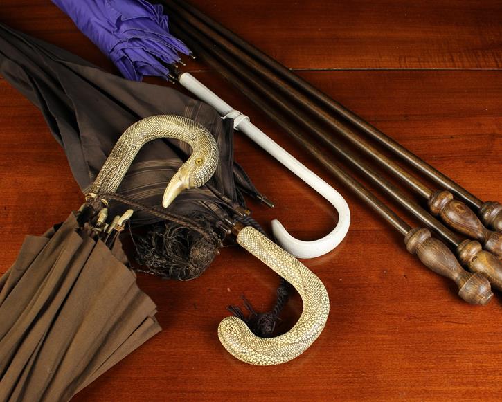 Two Vintage Brown Umbrellas with faux snake-skin handles;