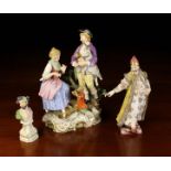Three Porcelain Figural Ornaments (A/F): A Meissen Musical Group depicting a seated lady with