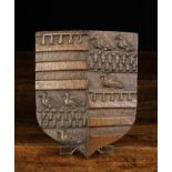 A Small 18th Century Carved Oak Armorial Shield incorporating bands of birds and wheatsheaths,