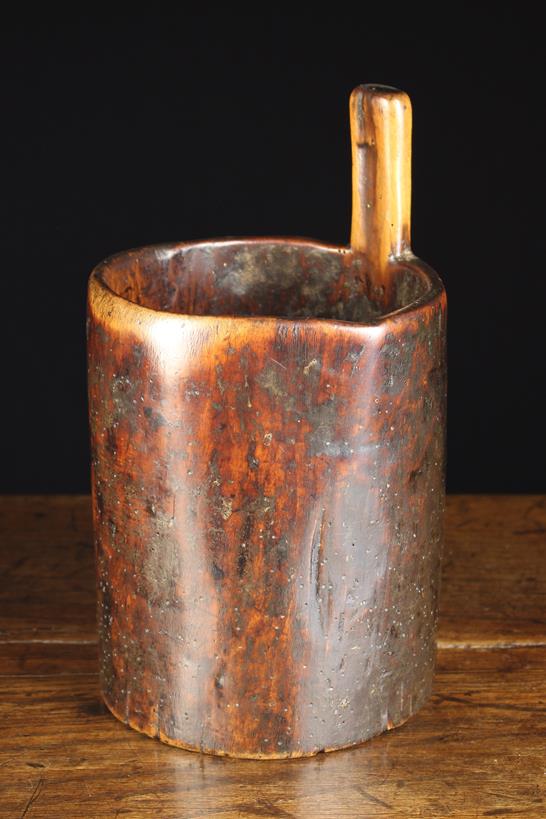 An 18th or 19th Century Dug Out Fruitwood Luggie, richly patinated.