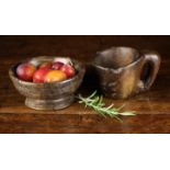 A 16th or 17th Century Turned Treen Bowl with moulded bands to the sides and flared pedestal foot,