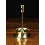 A Gothic Style Brass Candlestick.