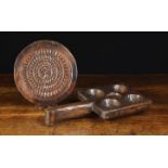 Two Pieces of 19th Century Treen: A circular slab mould carved on both sides with a flower head to