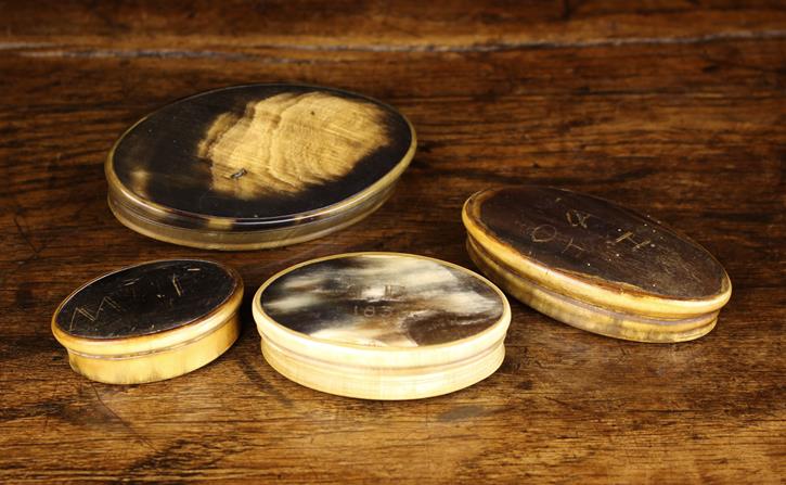 Four 19th Century Horn Snuff Boxes of oval form, The largest having a flat lid 4" x 2¼" (10 cm x 5.