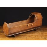 An Early 20th Century Boarded Pine Doll's Cradle, 10" (25.