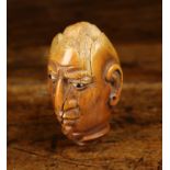 A 19th Century Carved Coquilla Nut Snuff Box carved possibly by a prisoner in the form of an