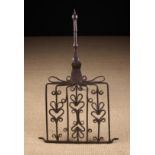 A Superb 18th Century Scottish Wrought Iron Down Hearth Grid Iron embellished with scrollwork and