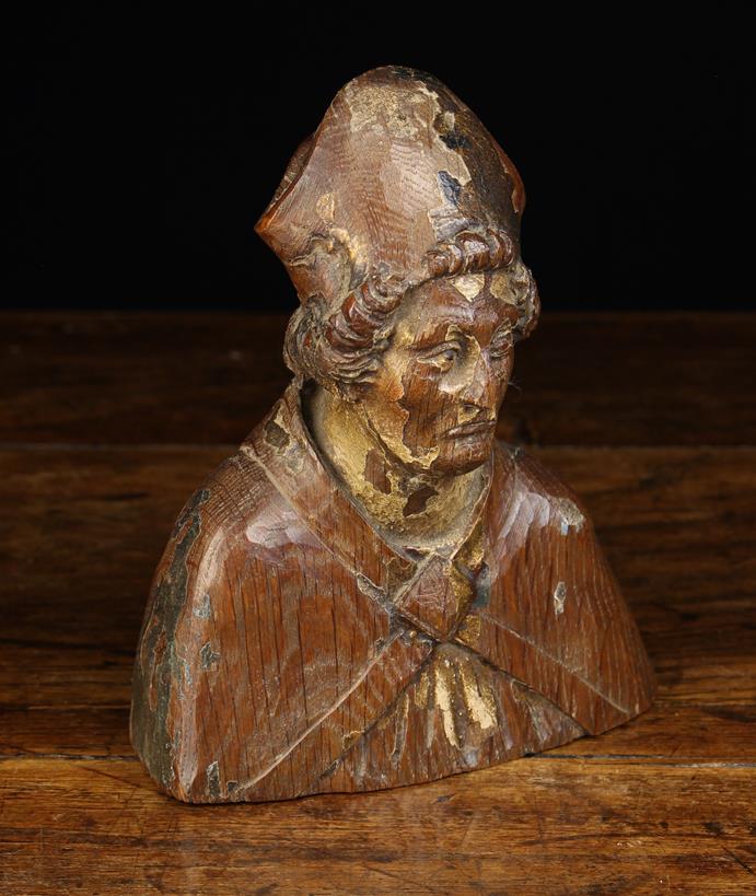 A Small 16th Century Carved Oak Flemish Bust of a Bishop with traces of residual polychrome,