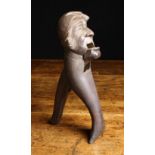 A Late 19th/Early 20th Century Treen Black Forest Nut Cracker carved in the form of a man's head