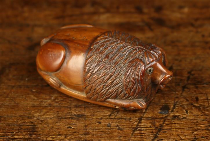 An Early 19th Century Coquilla Nut Snuff Box intricately carved in the form of a recumbent dog with - Image 2 of 4