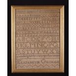 A 19th Century Sampler by Elizabeth George worked with alphabet and set in a glazed gilt frame,