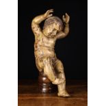 A Late 17th/Early 18th Century Style Flemish Polychromed Putto, 20" (51 cm) in height.