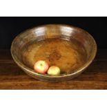A Large 18th Century Turned Sycamore Bowl having a flat round bottom and raised sides decorated