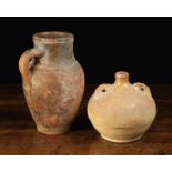 An Antique Earthenware Jug with a partially grazed green neck band 9½" (24 cm) in height,