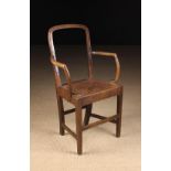 An Unusual Late 18th/Early 19th Century Child's Armchair having an open back and curved open arms,