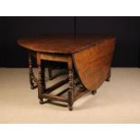 A Large & Impressive Charles II Walnut Double Gateleg Dining Table of rich colour & patination.