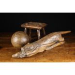 A Rustic Carving of Otter & Prey, 21" (54 cm) in length.