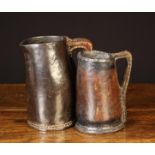 Two 17th Century Leather Jugs with cut out handles incorporated into the hand stitched side seams,