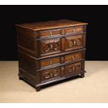 A Large Late 17th Century Oak Chest of Drawers in two sections.