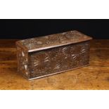 A 17th/Early 18th Century Chip Carved Oak Rectangular Box of boarded construction.