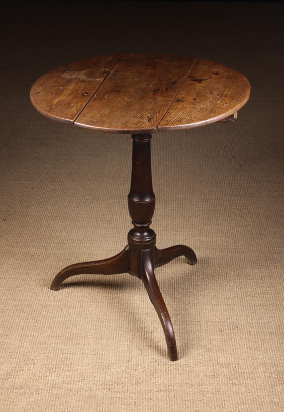 An 18th Century Oak Tilt Top Tripod Table (A/F).