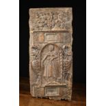 An Italian Renaissance Walnut Panel carved with a female figure in an arched niche to the centre