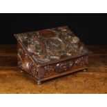 A Delightful 19th Century Fruitwood Desk Box enriched with elaborately carved appliqués.