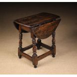 A 17th Century Joined Oak Low Table/Stool.