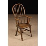 A 19th Century Ash & Elm Child's Stick Back Windsor Armchair.