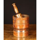 An 18th Century Turned Lignum Mortar 6¼" (16 cm) high, 5½" (14 cm) in diameter,